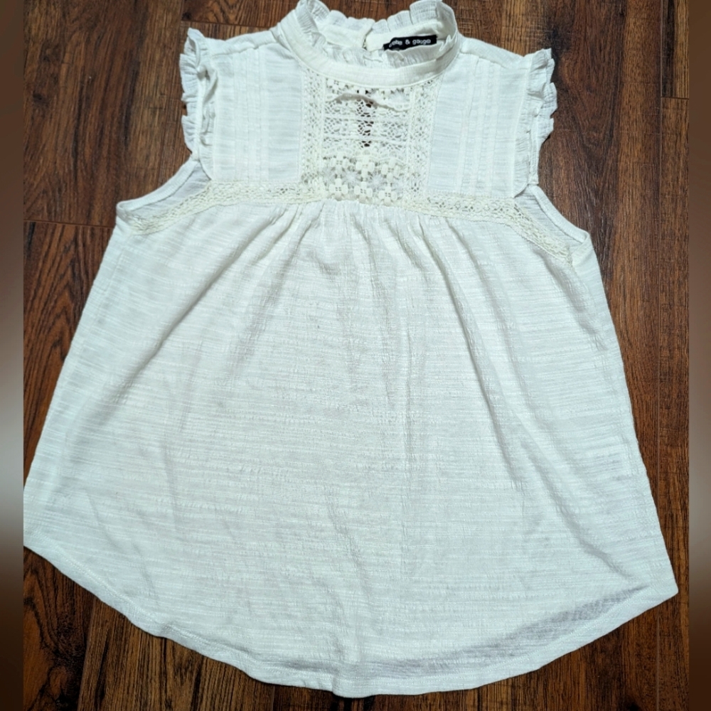 White sleeveless top